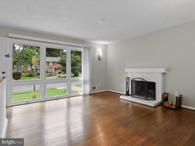 5415 Juliet St, Springfield, VA 22151 - unfurnished living room featuring a fireplace with raised hearth and wood finished floors