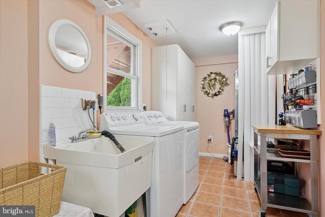 4133 Dana Ln, Lafayette Hill, PA 19444 - laundry room featuring cabinet space, washer and dryer, and light tile patterned floors