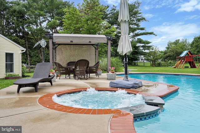4133 Dana Ln, Lafayette Hill, PA 19444 - view of pool featuring a pool with connected hot tub, a patio, outdoor dining area, a lawn, and a playground