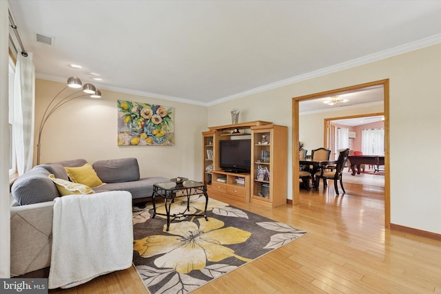 4133 Dana Ln, Lafayette Hill, PA 19444 - living area featuring ornamental molding, light wood-style floors, and a chandelier