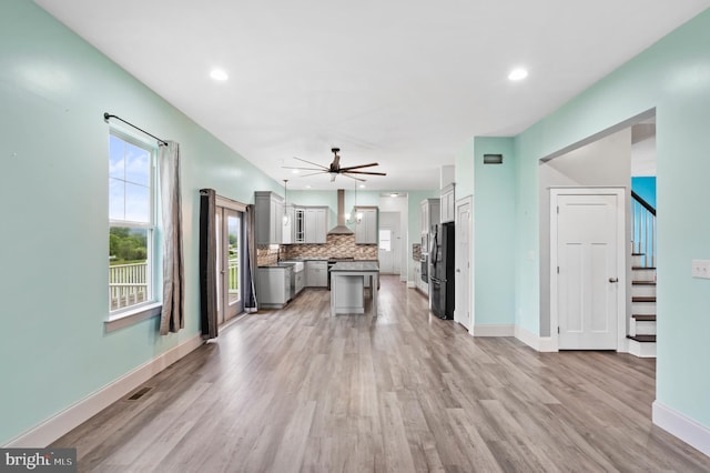 7 Compton Way, Barto, PA 19504 - unfurnished living room featuring light wood-type flooring, a ceiling fan, stairway, and recessed lighting