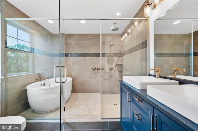 7 Compton Way, Barto, PA 19504 - bathroom with tile walls, double vanity, a shower stall, a freestanding bath, and recessed lighting