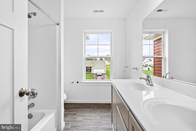 7 Compton Way, Barto, PA 19504 - bathroom featuring healthy amount of natural light, wood finished floors, double vanity, and tub / shower combination