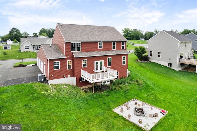 7 Compton Way, Barto, PA 19504 - rear view of house with a shingled roof, a wooden deck, a lawn, a residential view, and asphalt driveway