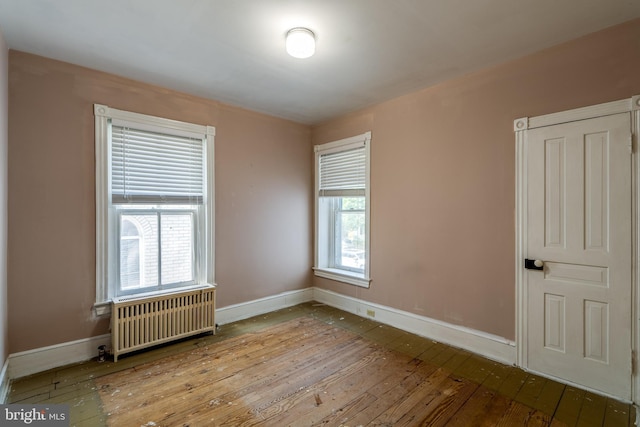 412 Main St, Denver, PA 17517 - spare room featuring radiator, hardwood / wood-style flooring, and plenty of natural light