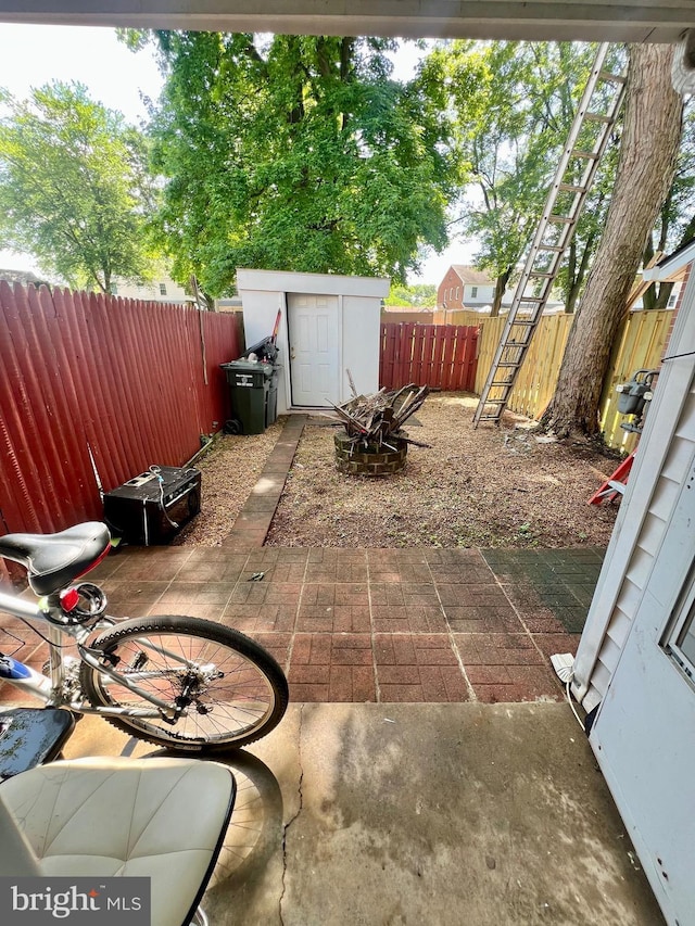 9837 Buckner Rd, Manassas, VA 20110 - fenced backyard featuring a storage shed and a patio