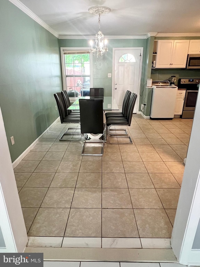 9837 Buckner Rd, Manassas, VA 20110 - dining area featuring washer / dryer, ornamental molding, light tile patterned floors, and a chandelier