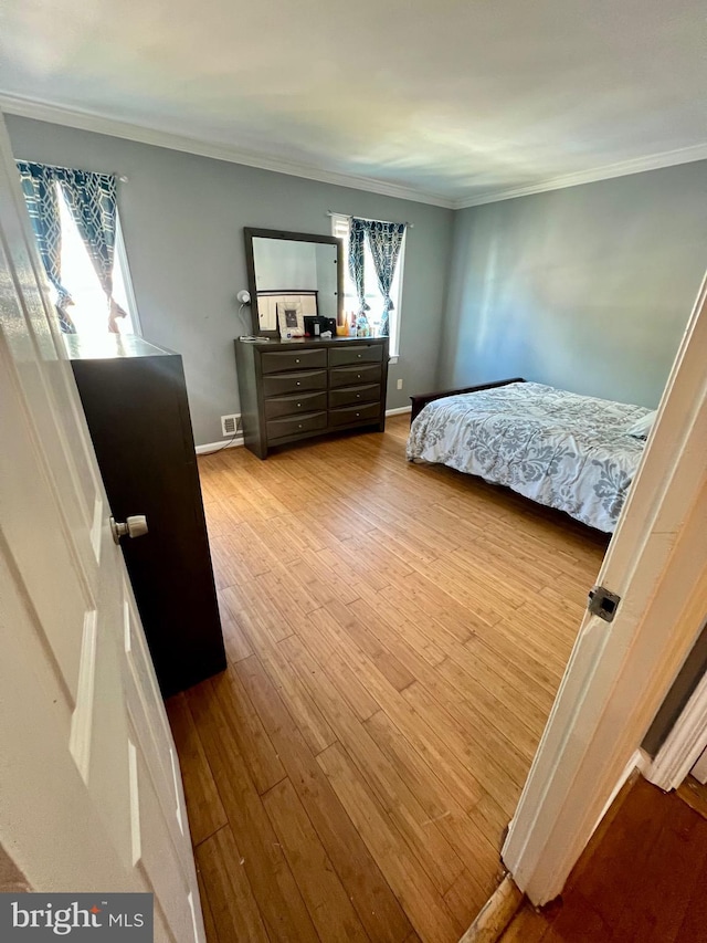 9837 Buckner Rd, Manassas, VA 20110 - bedroom with wood finished floors and crown molding