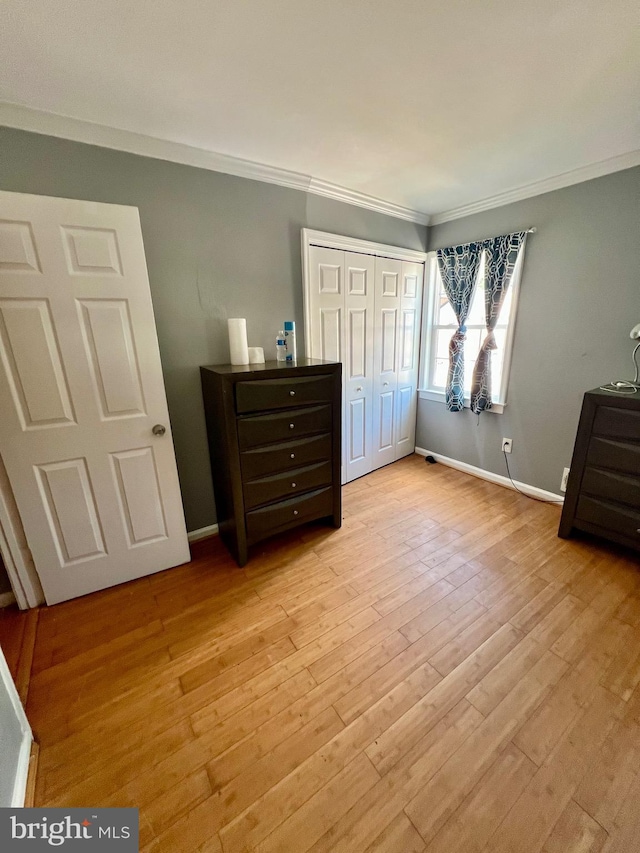 9837 Buckner Rd, Manassas, VA 20110 - unfurnished bedroom with crown molding, light wood finished floors, and a closet