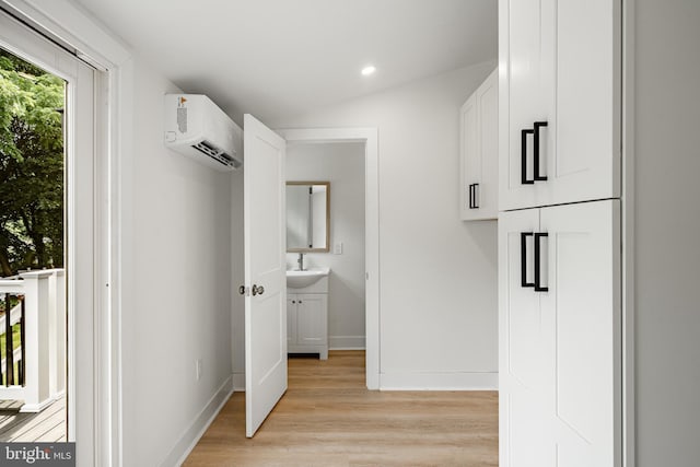 221 Ford St, Conshohocken, PA 19428 - hall with a wall unit AC, light wood-style flooring, and recessed lighting