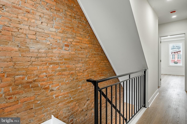 221 Ford St, Conshohocken, PA 19428 - corridor featuring an upstairs landing, brick wall, wood finished floors, and recessed lighting
