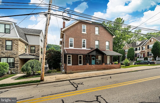 221 Ford St, Conshohocken, PA 19428 - multi unit property with brick siding, a chimney, and covered porch