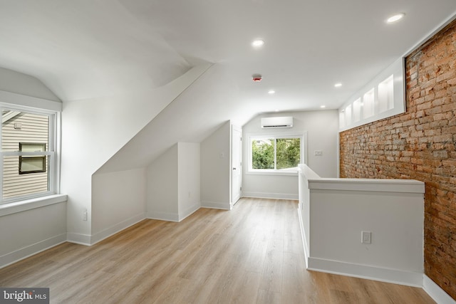 221 Ford St, Conshohocken, PA 19428 - bonus room with a wall mounted AC, vaulted ceiling, light wood-style floors, and recessed lighting