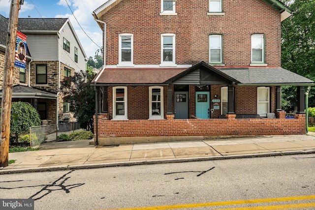 221 Ford St, Conshohocken, PA 19428 - view of property featuring brick siding and a porch