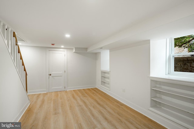 221 Ford St, Conshohocken, PA 19428 - below grade area with light wood-style floors, stairs, recessed lighting, and built in shelves