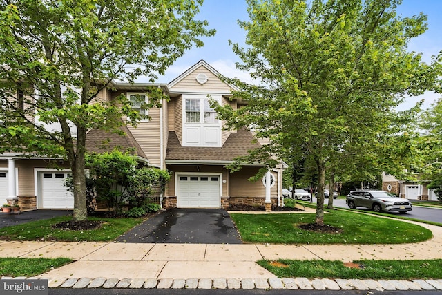 52 Ocean Breeze Ct, Manahawkin, NJ 08050 - view of front facade featuring driveway, stone siding, a shingled roof, a front yard, and a garage