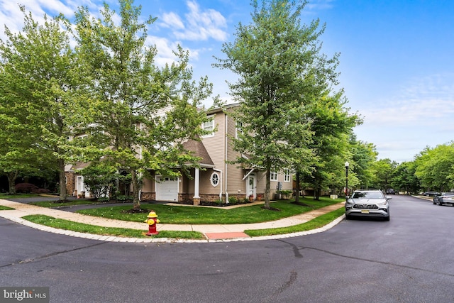 52 Ocean Breeze Ct, Manahawkin, NJ 08050 - view of property hidden behind natural elements featuring a front lawn