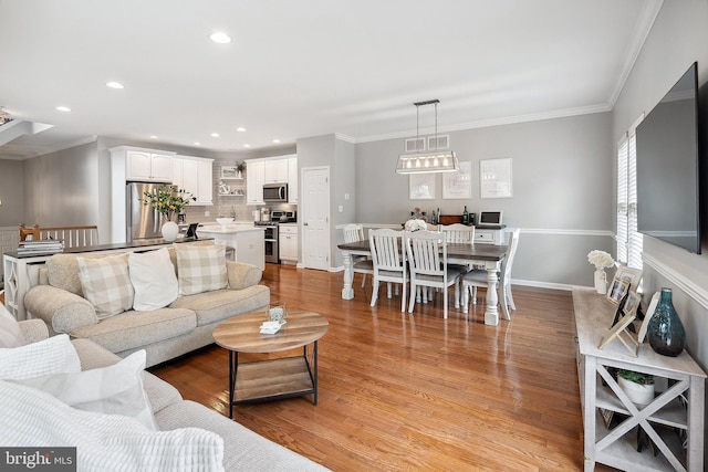 52 Ocean Breeze Ct, Manahawkin, NJ 08050 - living room with crown molding, light wood-type flooring, and recessed lighting