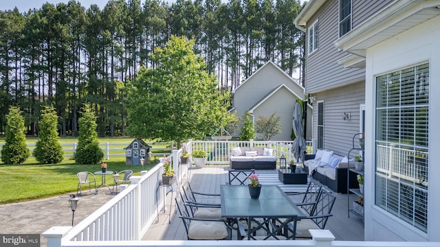 13474 Rustling Oaks Dr, Wye Mills, MD 21679 - wooden deck featuring an outdoor living space, a lawn, and outdoor dining area