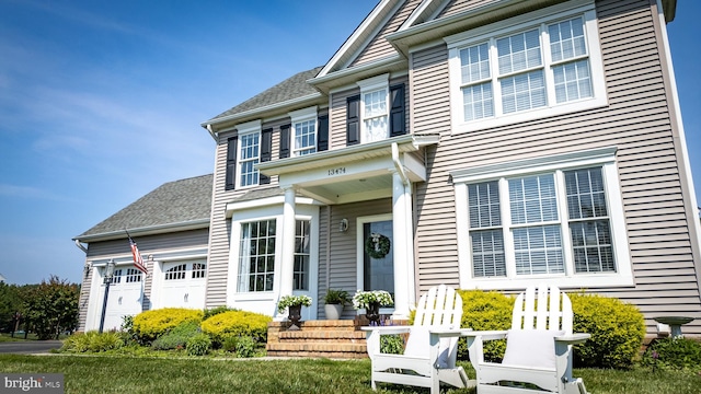 13474 Rustling Oaks Dr, Wye Mills, MD 21679 - view of front of house featuring a garage and roof with shingles