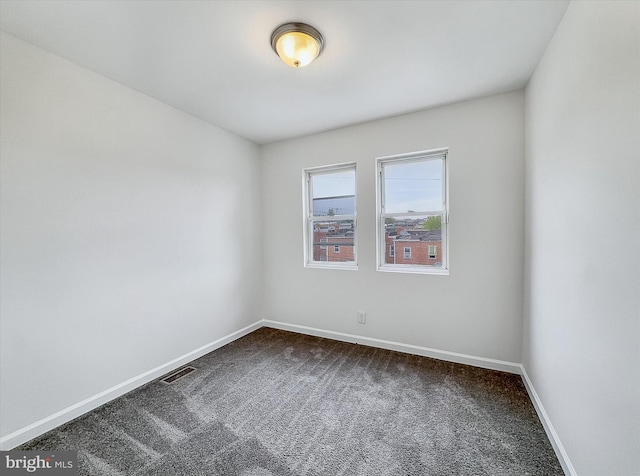 3922 Woodridge Rd, Baltimore, MD 21229 - unfurnished room with dark carpet and baseboards