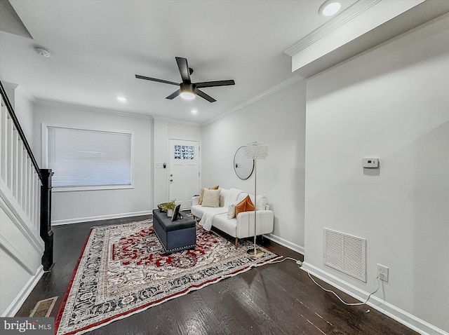 3922 Woodridge Rd, Baltimore, MD 21229 - living room featuring dark wood-style flooring, ceiling fan, ornamental molding, stairway, and recessed lighting
