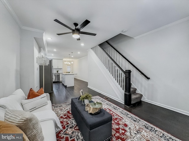 3922 Woodridge Rd, Baltimore, MD 21229 - living area featuring dark wood-style flooring, stairway, ornamental molding, a ceiling fan, and recessed lighting