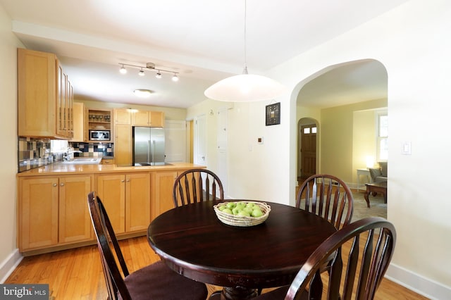 1203 Old Boalsburg Rd, State College, PA 16801 - dining area featuring arched walkways and light wood-style flooring