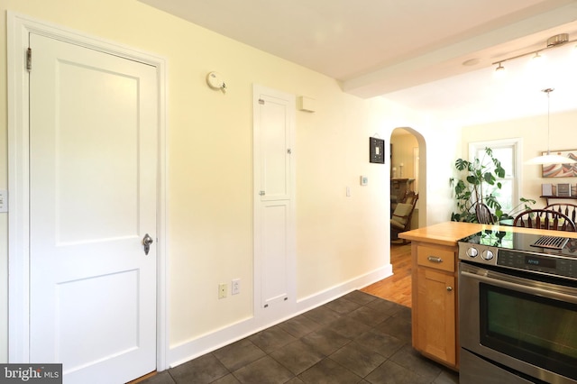 1203 Old Boalsburg Rd, State College, PA 16801 - kitchen featuring electric range, arched walkways, decorative light fixtures, wood counters, and brown cabinetry