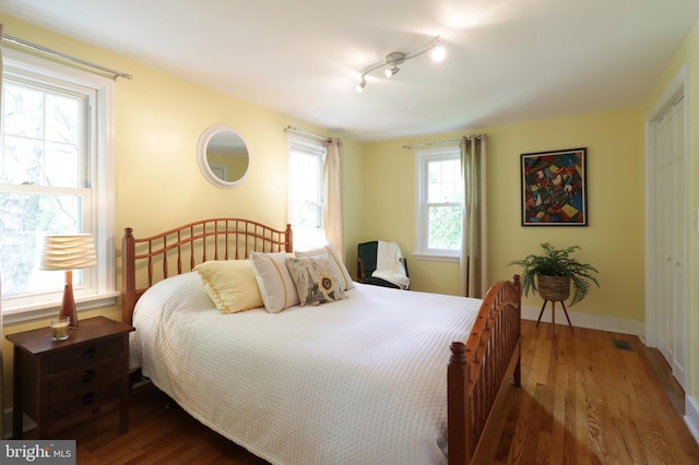 1203 Old Boalsburg Rd, State College, PA 16801 - bedroom with wood finished floors, rail lighting, and a closet