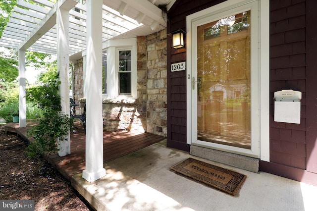 1203 Old Boalsburg Rd, State College, PA 16801 - entrance to property featuring covered porch, a pergola, and stone siding