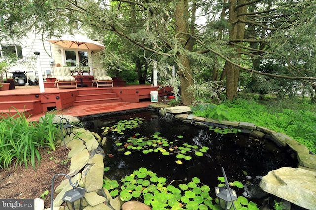 1203 Old Boalsburg Rd, State College, PA 16801 - view of yard featuring a wooden deck and a small pond