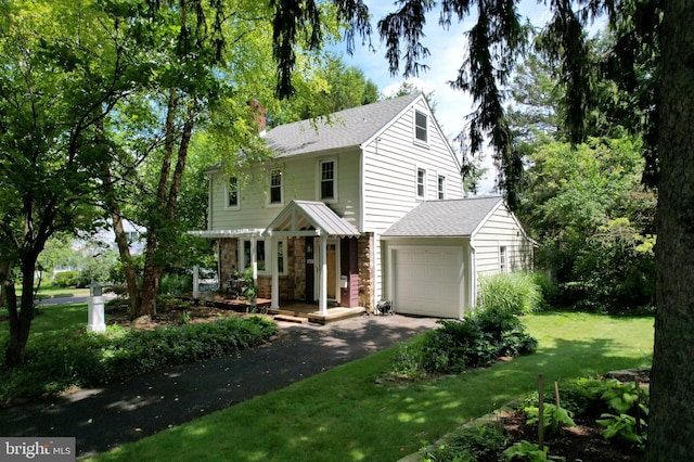 1203 Old Boalsburg Rd, State College, PA 16801 - view of front of house with driveway, an attached garage, roof with shingles, a front yard, and stone siding