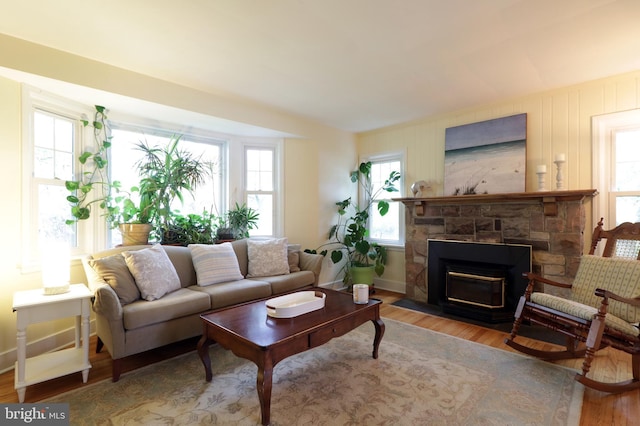 1203 Old Boalsburg Rd, State College, PA 16801 - living area featuring wood finished floors and a stone fireplace