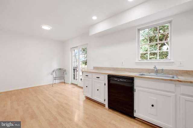 1951 Flowering Tree Ter, Silver Spring, MD 20902 - kitchen with dishwasher, healthy amount of natural light, light countertops, white cabinets, and recessed lighting