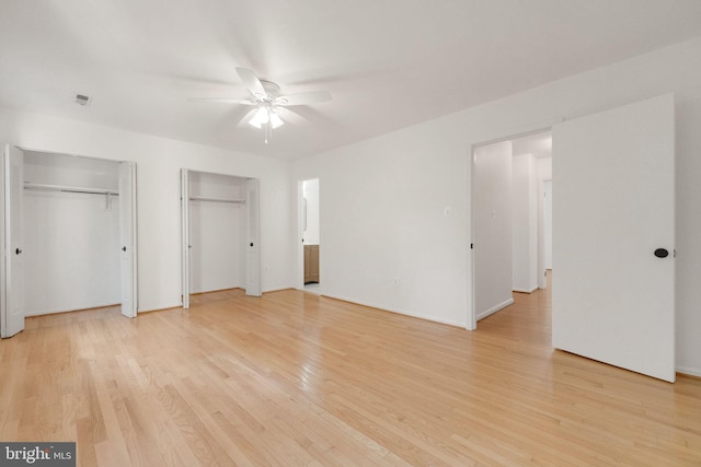 1951 Flowering Tree Ter, Silver Spring, MD 20902 - unfurnished bedroom with multiple closets, light wood-style flooring, and ceiling fan