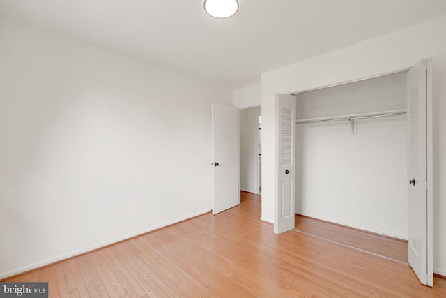 1951 Flowering Tree Ter, Silver Spring, MD 20902 - unfurnished bedroom with a closet and light wood-style flooring