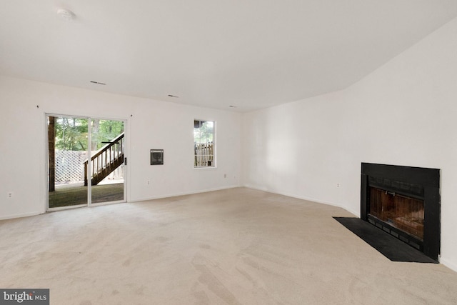1951 Flowering Tree Ter, Silver Spring, MD 20902 - unfurnished living room with light carpet and a fireplace with flush hearth
