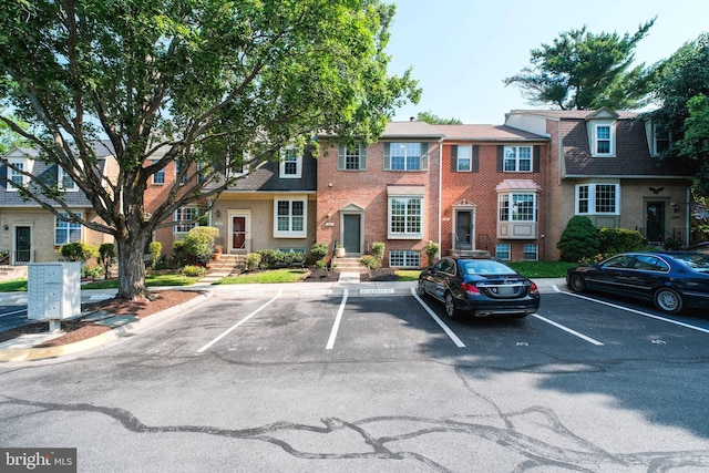 1951 Flowering Tree Ter, Silver Spring, MD 20902 - view of property with uncovered parking and brick siding