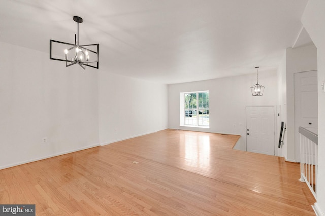 1951 Flowering Tree Ter, Silver Spring, MD 20902 - unfurnished dining area featuring a chandelier and wood finished floors