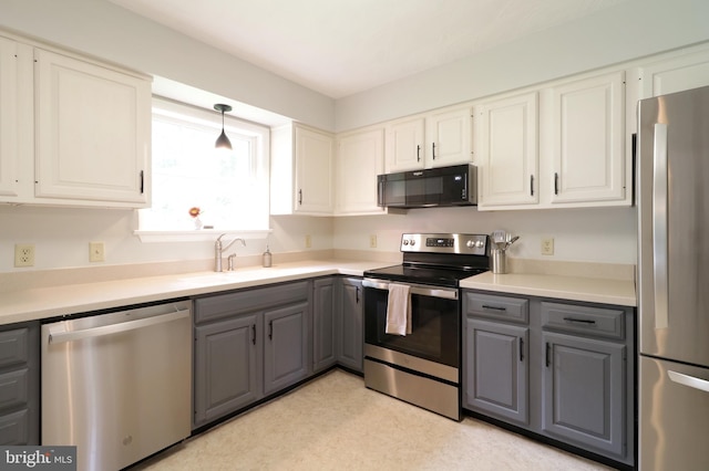1239 Circleville Rd, State College, PA 16803 - kitchen with stainless steel appliances, gray cabinetry, white cabinets, and light countertops