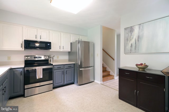 1239 Circleville Rd, State College, PA 16803 - kitchen with appliances with stainless steel finishes, white cabinets, and light countertops