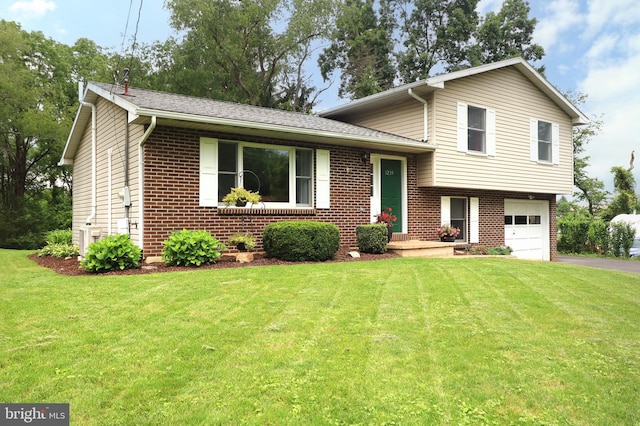 1239 Circleville Rd, State College, PA 16803 - tri-level home with brick siding, driveway, a garage, and a front yard