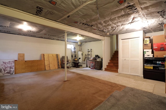 1239 Circleville Rd, State College, PA 16803 - finished below grade area with water heater, stairs, and carpet flooring