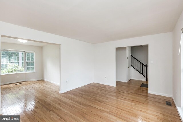 18432 Gardenia Way, Gaithersburg, MD 20879 - spare room with light wood-style flooring and stairway