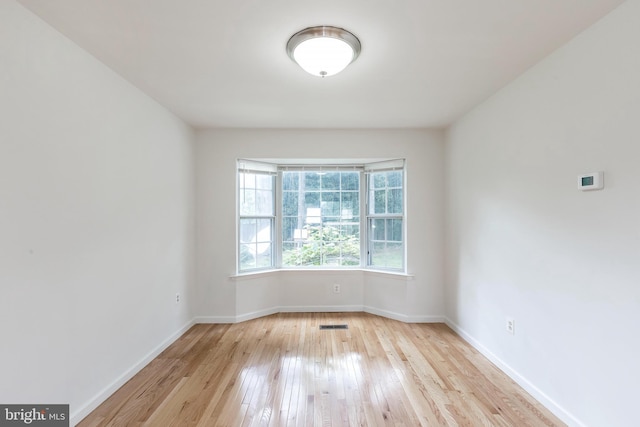 18432 Gardenia Way, Gaithersburg, MD 20879 - spare room featuring hardwood / wood-style flooring and baseboards