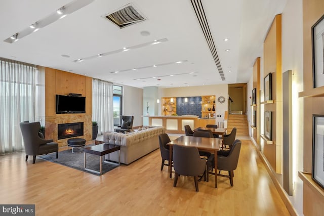 475 K St NW Unit 522, Washington, DC 20001 - living area featuring a fireplace and light wood finished floors