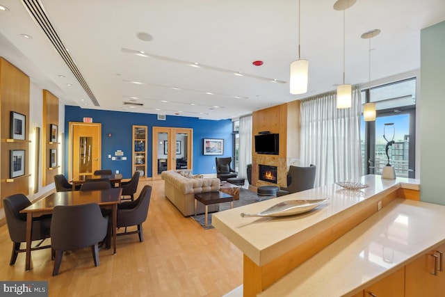 475 K St NW Unit 522, Washington, DC 20001 - living area with light wood finished floors, a large fireplace, and recessed lighting