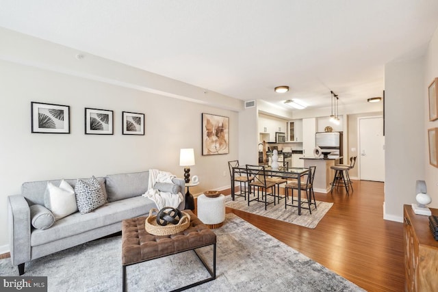 475 K St NW Unit 522, Washington, DC 20001 - living area featuring wood finished floors and baseboards