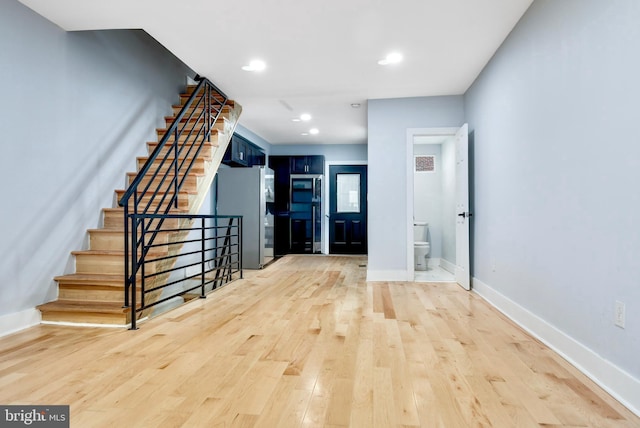 3914 Brandywine St, Philadelphia, PA 19104 - foyer with light wood-style floors, stairway, and recessed lighting